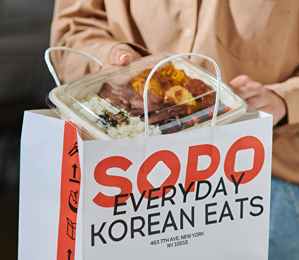Korean takeout meal from Sopo Korean Eats featuring purple rice, beef, and side dishes, ready for pickup or delivery.