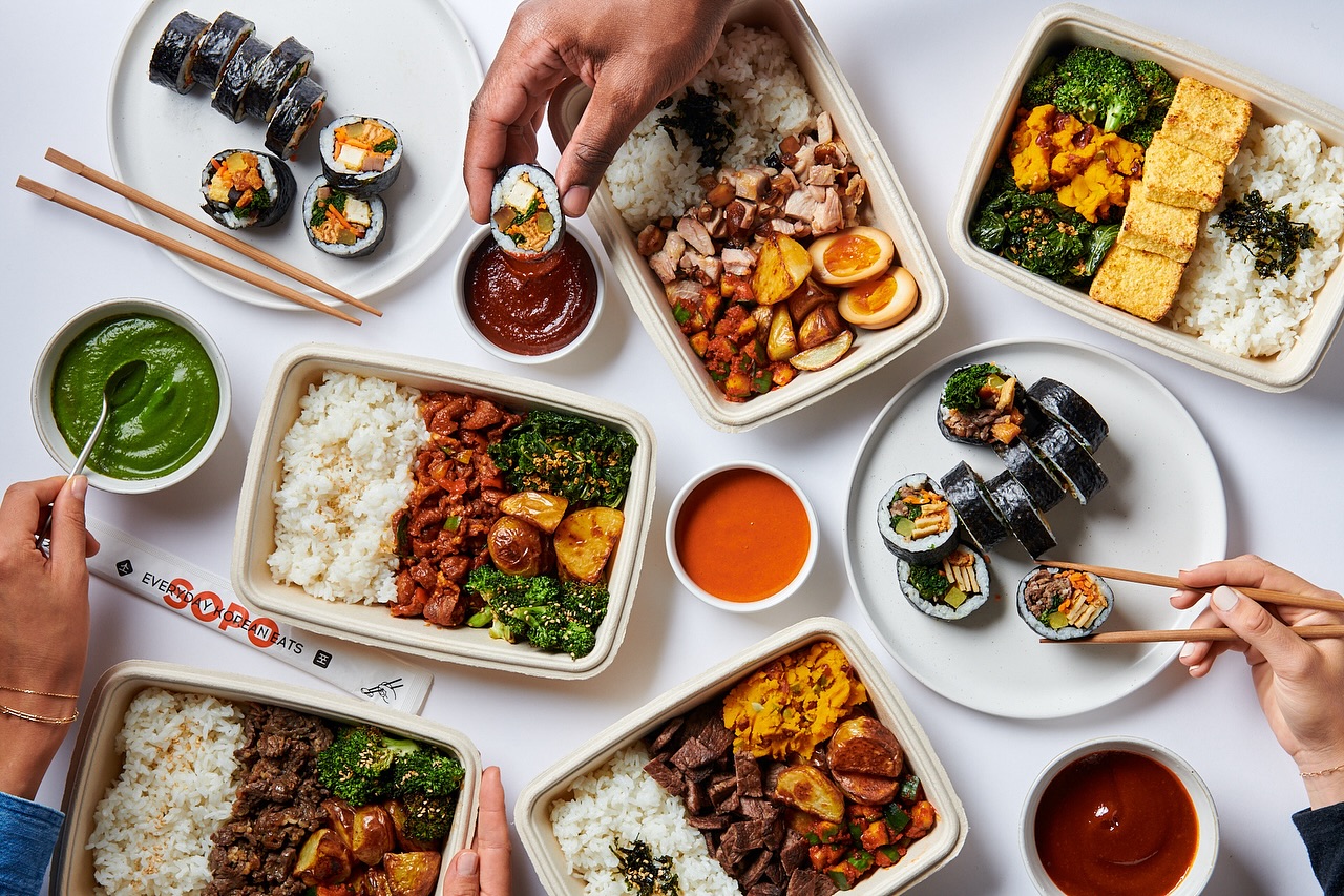Beef bulgogi plate with rice, Korean side dishes, and sauce at Sopo Korean Eats, Midtown NYC.