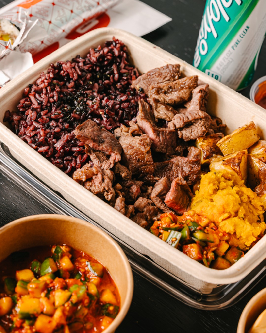 Sopo Korean Eats plates with bulgogi, rice, and signature sides in Midtown NYC.