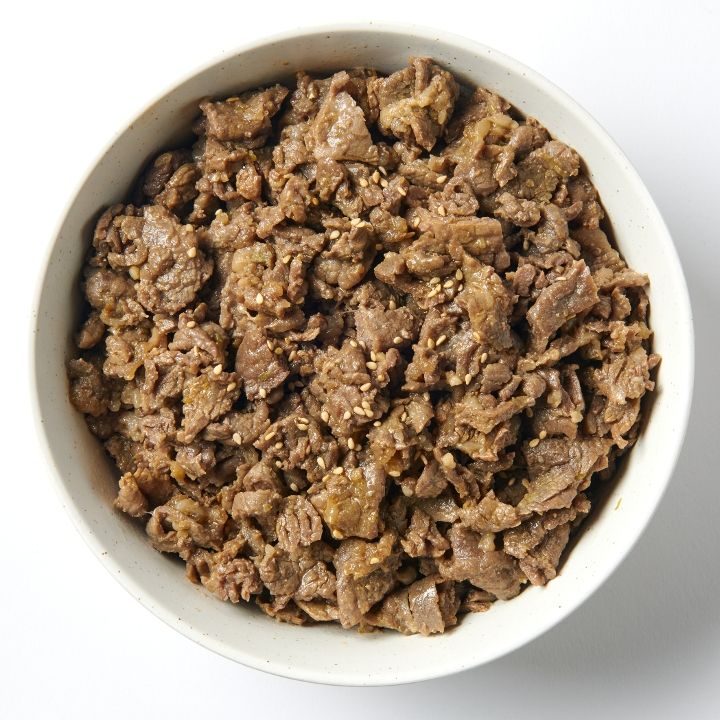 Tender Beef Bulgogi plate at Sopo Korean Eats, Midtown NYC, featuring marinated ribeye, purple rice, and signature sides.