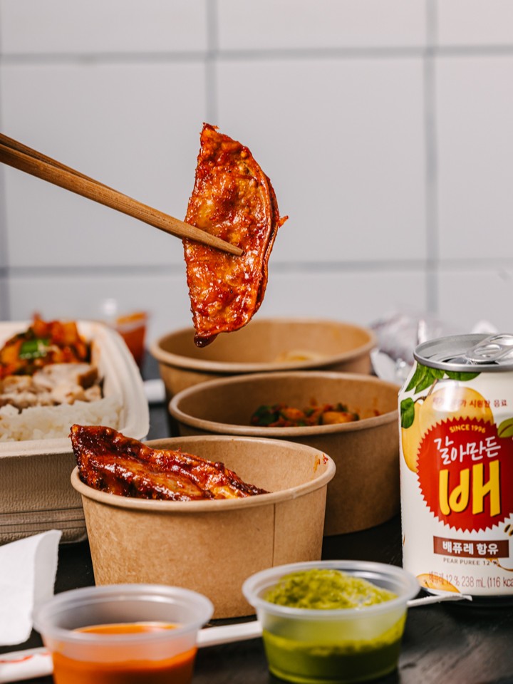 Sopo Korean Eats’ scallion dumpling, paired with sauces and Korean pear drink.