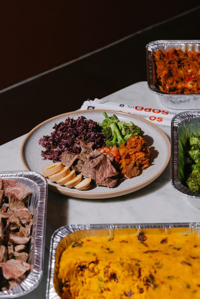 Korean office lunch spread from Sopo Korean Eats in Midtown NYC with a bulgogi plate, kimbap, and sides