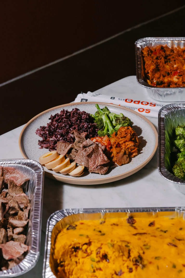 Korean office lunch spread from Sopo Korean Eats in Midtown NYC with a bulgogi plate, kimbap, and sides