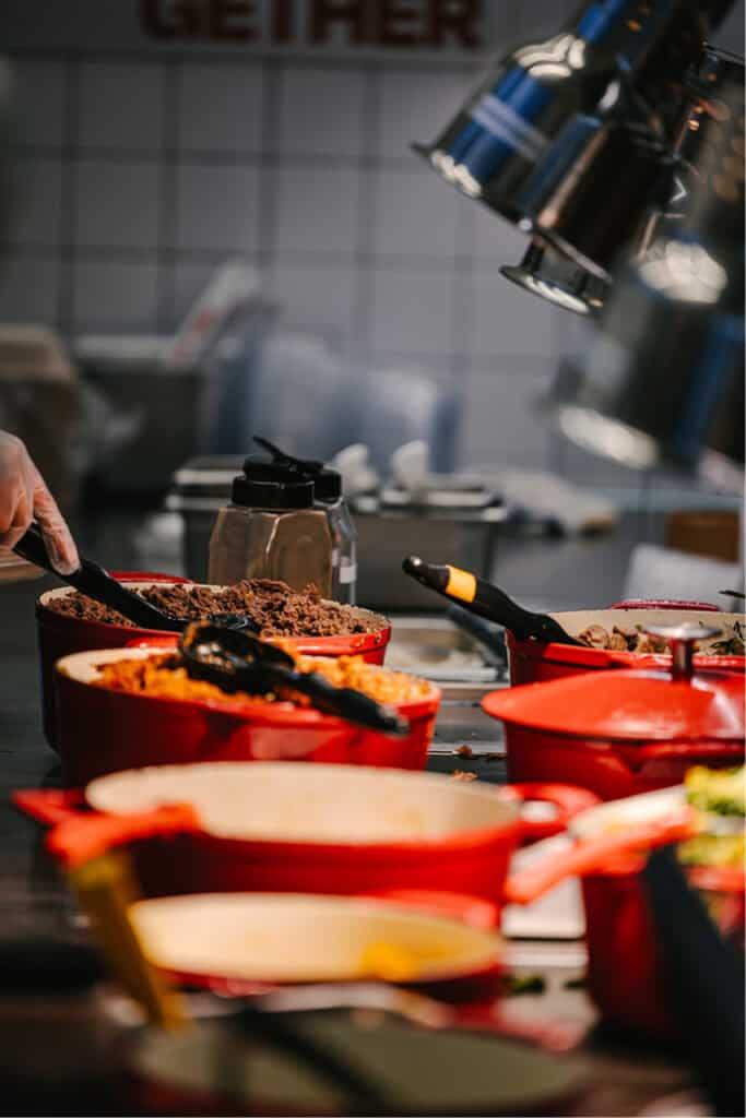 Korean lunch delivery from Sopo Korean Eats: a build-your-own plate with bulgogi, kimbap, and sides at a Midtown desk